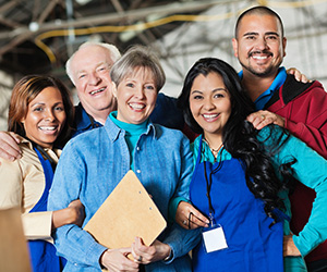 employees posing for a picture together