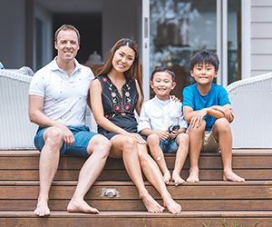 family sitting on porch