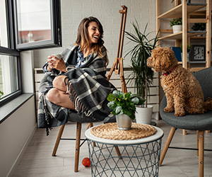 woman and dog on chairs